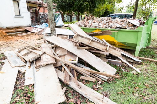 Household waste being loaded into a skip